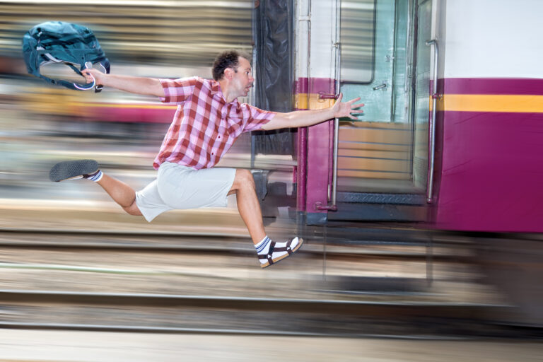 Tourist,With,Bag,Running,Behind,The,Train.,A,Man,Runs