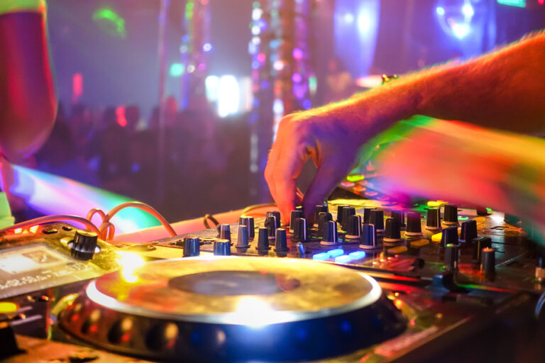 Close,Up,Of,Dj,Playing,Party,Music,On,Modern,Cd