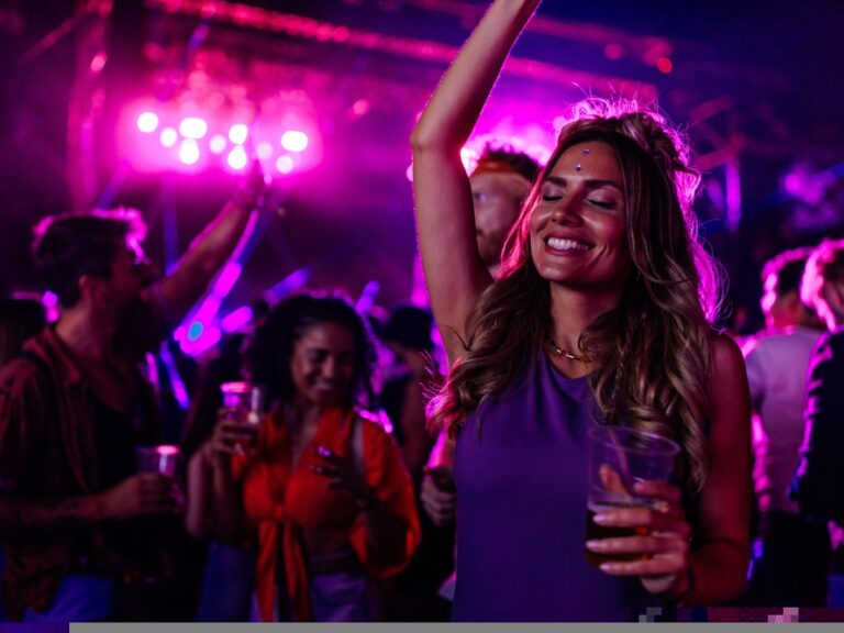 A,Young,Caucasian,Woman,Is,Dancing,At,A,Concert,Having